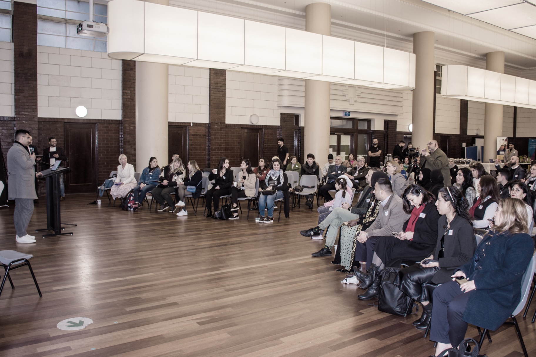 Community event with founders gathered for a program.